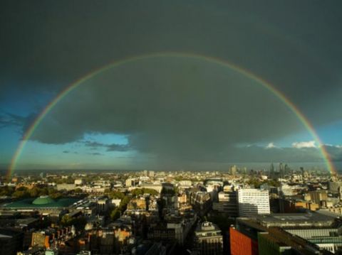 Double rainbow arcs over London skyline