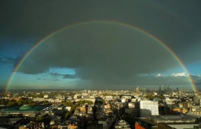 Double rainbow arcs over London skyline