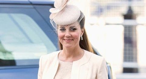 Pregnant Kate Middleton glows in nude dress